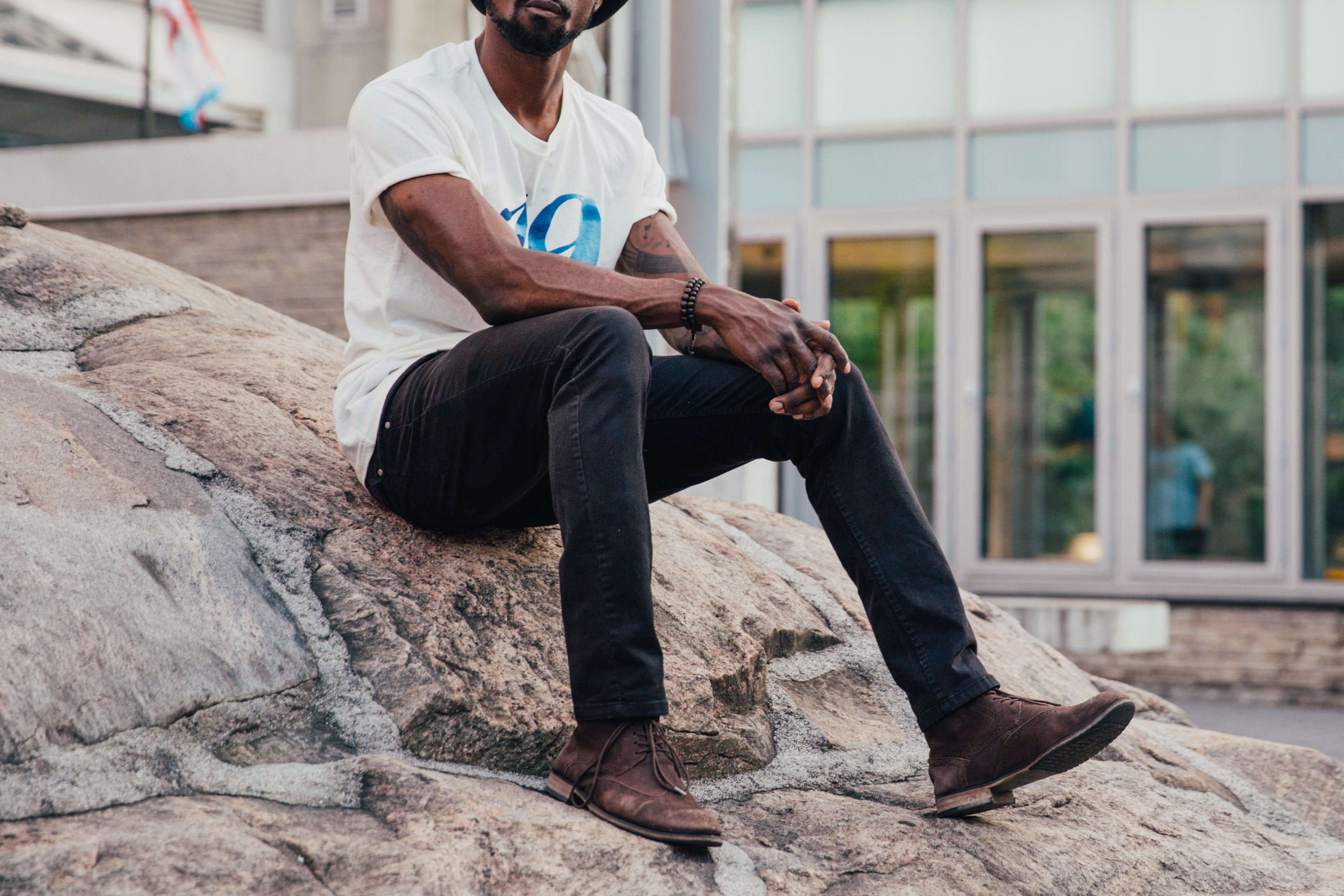 files/casual-man-sits-on-rock.jpg